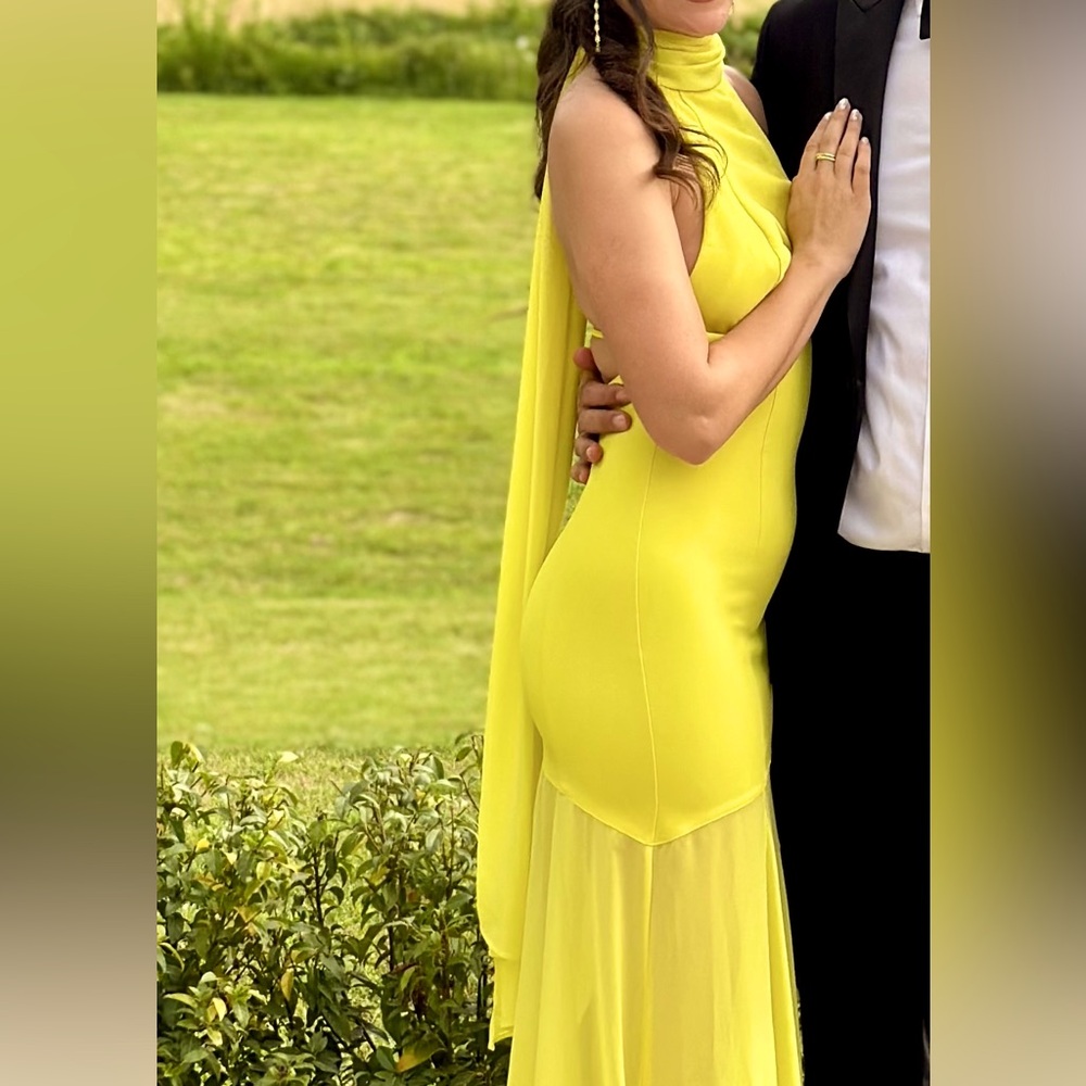 Gorgeous slim flowing yellow sleeveless gown, high neck enclosure with open back